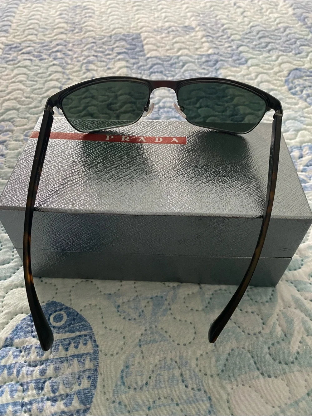 Prada Black Frame Sunglasses with Dark Green Lenses